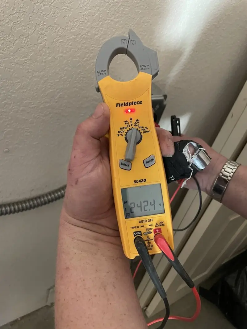 Voltage testing with clamp meter during Outlet Installation in Broadmoor